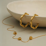 Woven Twist & Cross Mid-Size Hoop Earrings